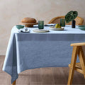 alt="Featuring blue hemp tablecloth in a luxurious table setup"