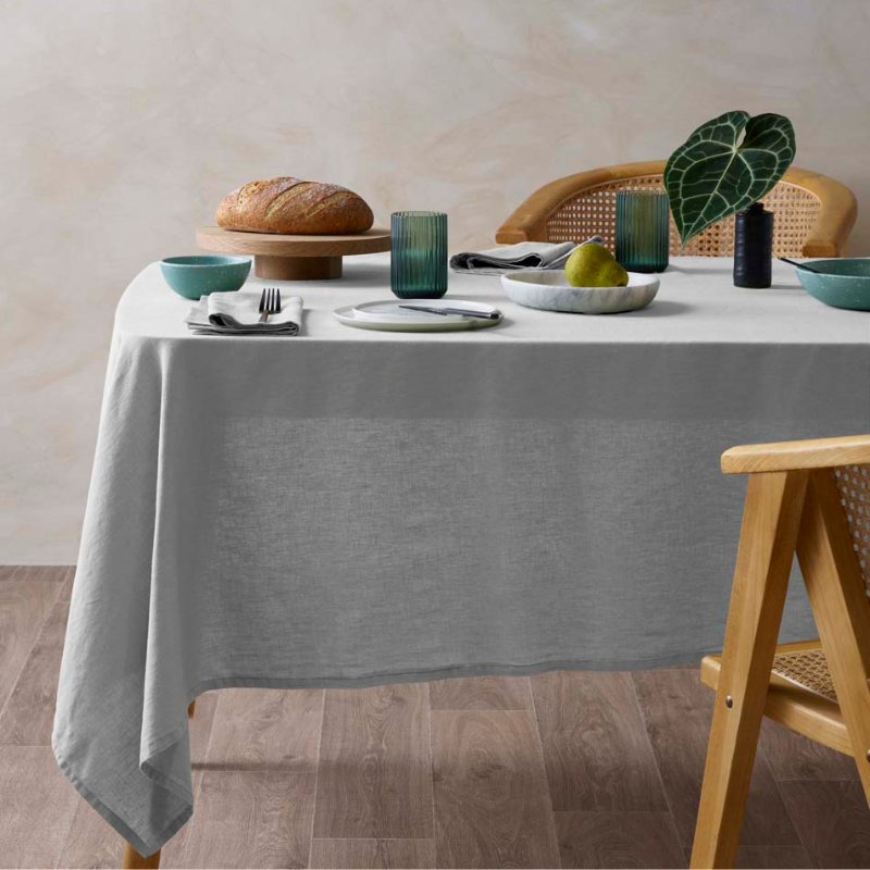 alt="Featuring grey hemp tablecloth in a luxurious table setup"