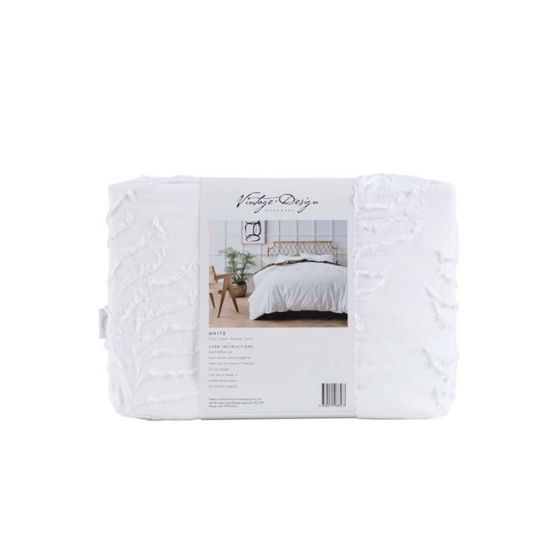 alt="A white cotton chenille quilt cover set, crafted with a textured 100% cotton fabric in a packaging"
