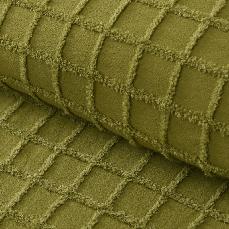 Zoom in details of a green quilt cover and pillowcases in a stylish and modern design add a touch of elegance to your bedroom.