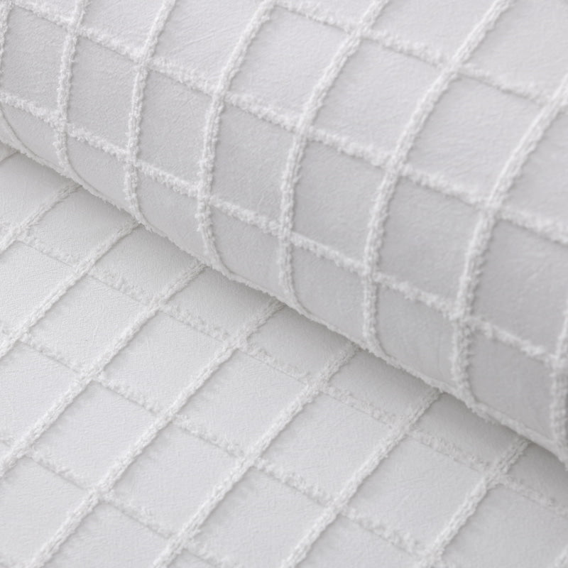 Closer look of a white quilt cover and pillowcases in a stylish and modern design add a touch of elegance to your bedroom.