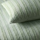 alt="Close up details of a sage quilt cover set featuring chenille stripes and minimalistic style"