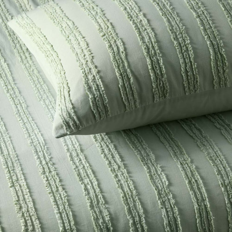 alt="Close up details of a sage quilt cover set featuring chenille stripes and minimalistic style"