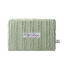 alt="Front packaging details of a sage quilt cover set featuring chenille stripes and minimalistic style"
