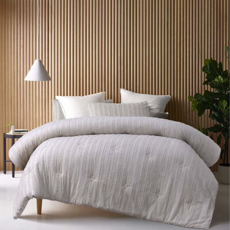 alt="A natural comforter set featuring chenille stripes design and adding minimalistic style on a cosy bedroom"
