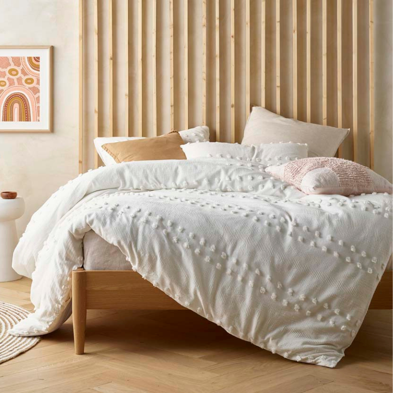 alt="Closer look of a chenille and waffle pattern quilt cover set in chic minimalist style"