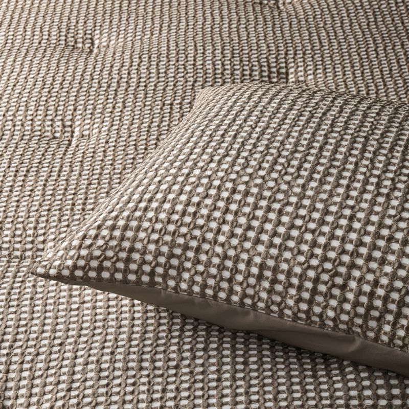 Accessorize Hokey Pokey Waffle Comforter in soft natural shade with matching pillowcases.