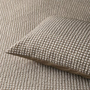 Soft and breathable waffle quilt cover in natural colour, shown with pillowcases.