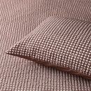 Tobacco waffle quilt cover set styled with matching pillowcases on a bed.