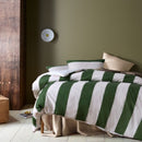 Wide green and white stripes on cotton quilt cover..