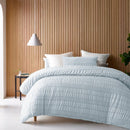 Accessorize Seersucker Ice Blue Quilt Cover Set styled with white pillows.