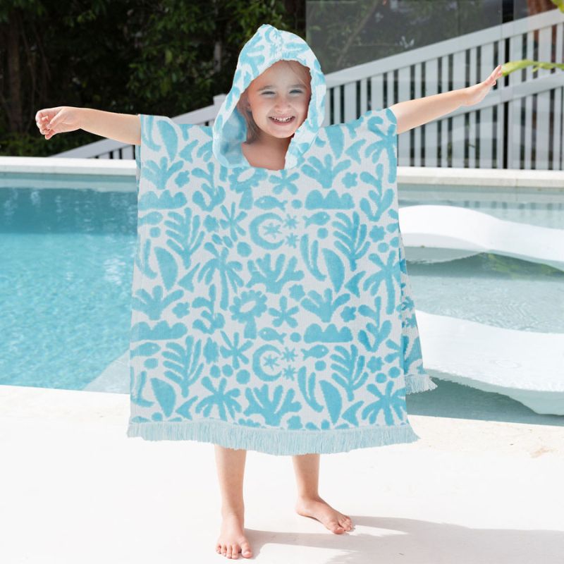 Close-up of soft cotton fabric with sky-blue pattern on the poncho.