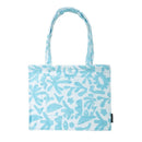 Close-up of the sky-blue cotton jacquard fabric on the Bambury HiLo Holiday Tote Bag.