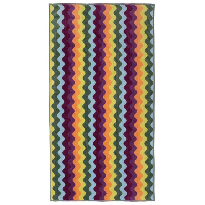 Vibrant cotton beach towel featuring retro wavy stripes from Bambury.