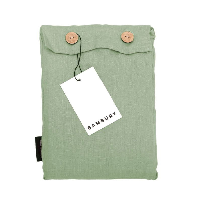 Close-up of sage green linen European pillowcase showing relaxed, natural texture.