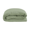 Close-up of sage green linen quilt cover showing relaxed, soft texture.