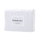 Close-up of pure white linen quilt cover showing soft natural texture.