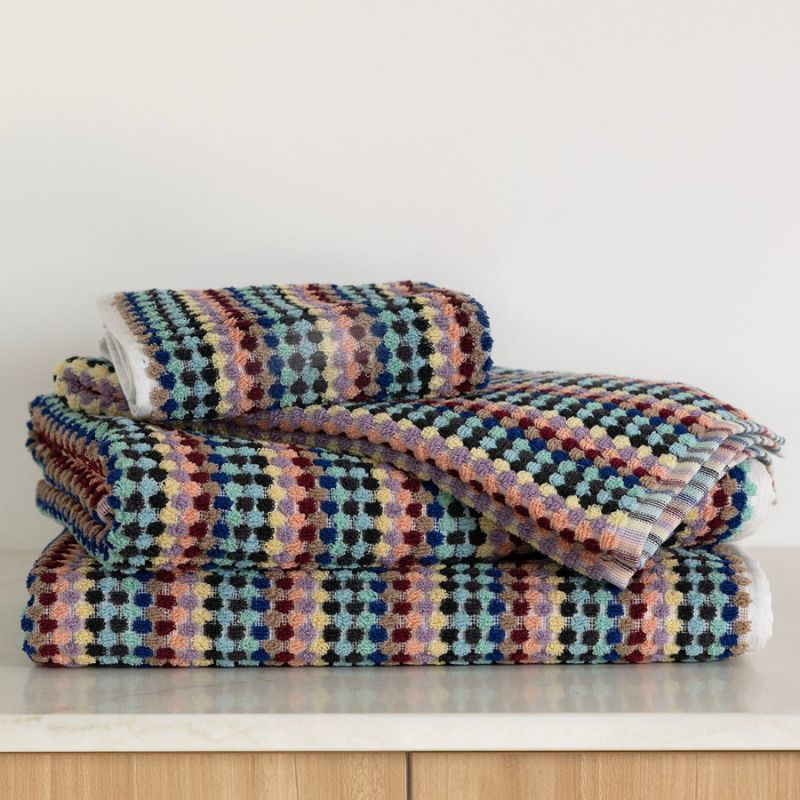 Retro-inspired Bambury Miami Pom Pom Hand Towel styled in a modern bathroom.