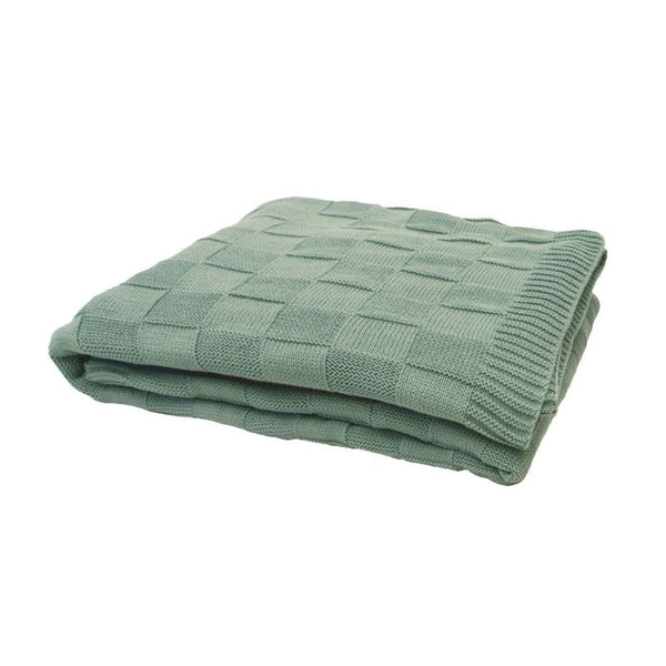 Close-up of the eucalyptus knitted throw texture and border detail.