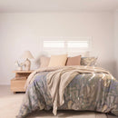 Close-up of cotton quilt cover showing subtle floral pattern in beige and sage tones.