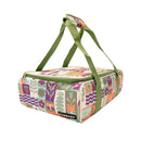 Colorful insulated lunch bag with floral pattern and green straps on a white background