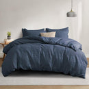 Blue haze waffle quilt cover set with matching pillowcases and beige headboard.