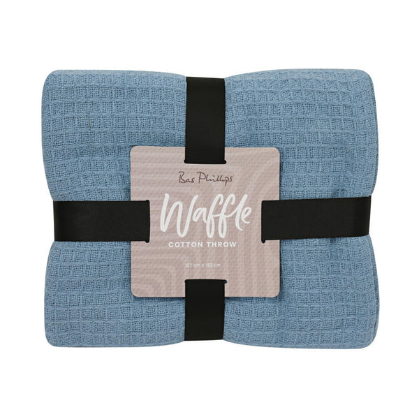 Lightweight periwinkle cotton throw perfect for layering on sofa or bed.