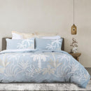Light blue embroidered quilt cover set with matching pillowcases and natural décor