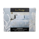 Light blue embroidered quilt cover set with matching pillowcases and natural décor
