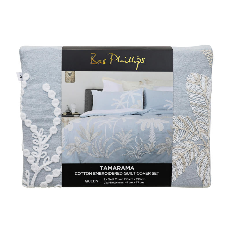 Light blue embroidered quilt cover set with matching pillowcases and natural décor