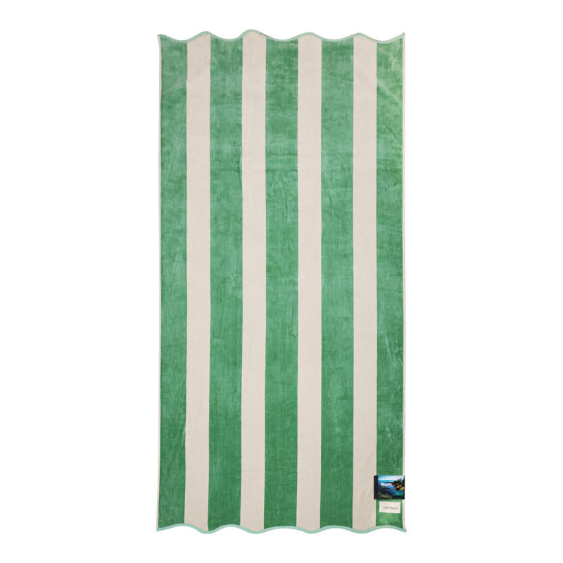 Soft striped cotton beach towel in pistachio and cream with scalloped edge detail