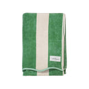 Soft striped cotton beach towel in pistachio and cream with scalloped edge detail