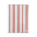 Lightweight striped cotton beach towel featuring coral and cream stripes with fringed trim