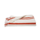 Lightweight striped cotton beach towel featuring coral and cream stripes with fringed trim