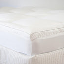 Close-up of plush high-loft Ardor mattress topper on bed.
