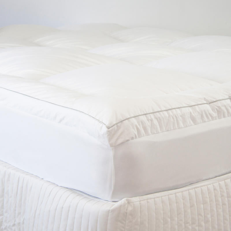 Close-up of plush high-loft Ardor mattress topper on bed.