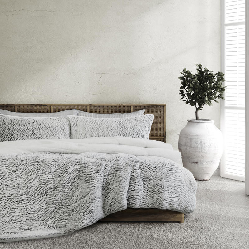 Faux fur comforter set in silver tone with matching pillowcases.