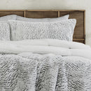 Faux fur comforter set in silver tone with matching pillowcases.