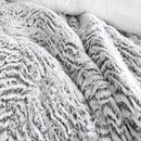 Faux fur comforter set in silver tone with matching pillowcases.