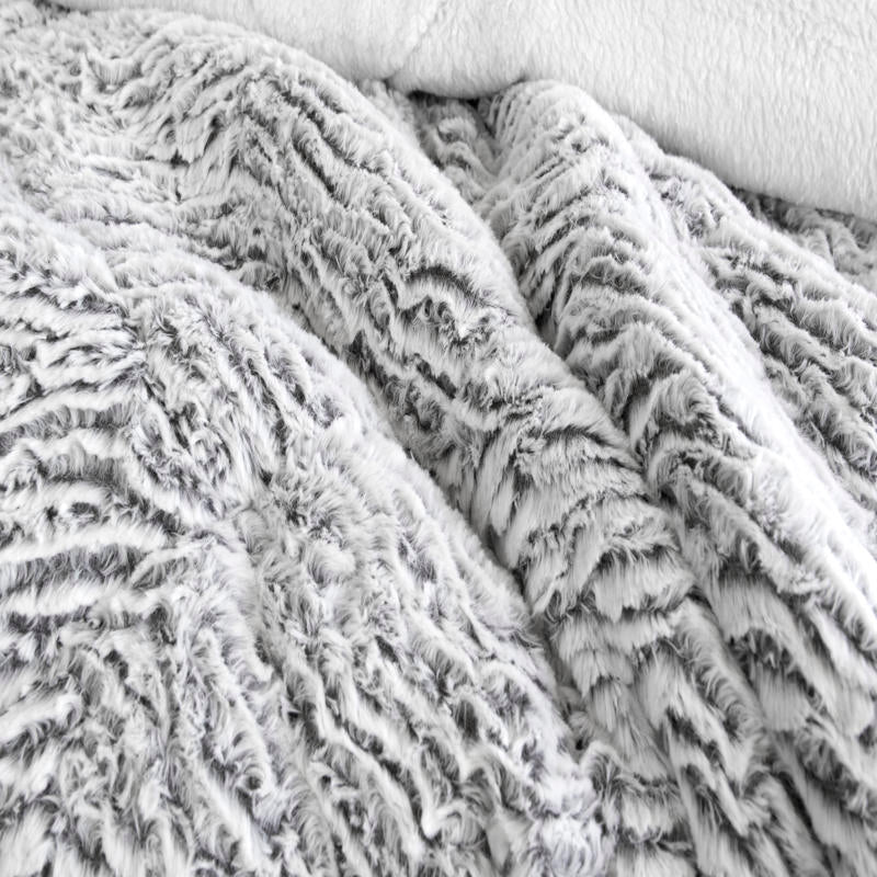 Faux fur comforter set in silver tone with matching pillowcases.