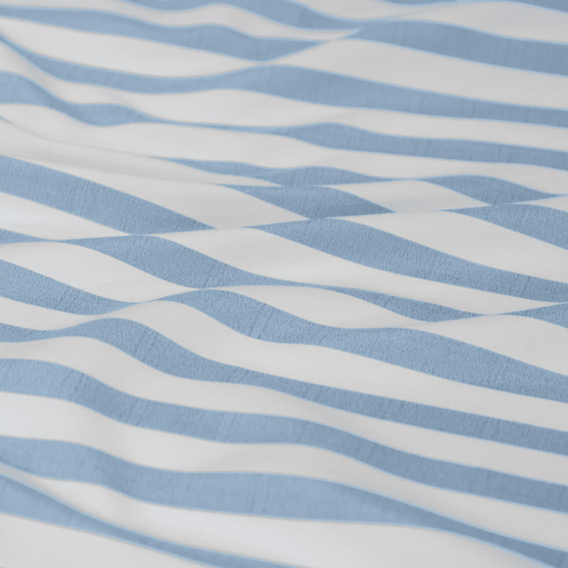 Classic blue and white stripes evoke relaxed coastal charm and timeless appeal.