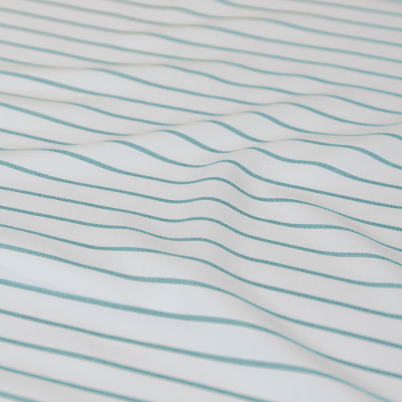 Classic blue and white stripes evoke relaxed coastal charm and timeless appeal.