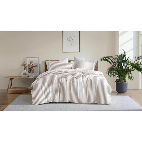 Neutral stripe quilt cover set creating a calm, minimal bedroom look.