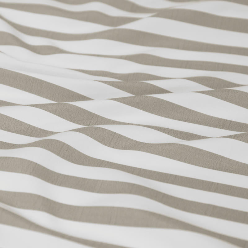 Neutral stripe quilt cover set creating a calm, minimal bedroom look.