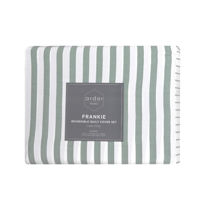 Coastal-inspired sage and white stripe quilt cover set in a relaxed modern bedroom.