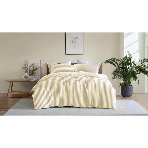 Bright and cheerful yellow stripe quilt cover set in a modern bedroom.