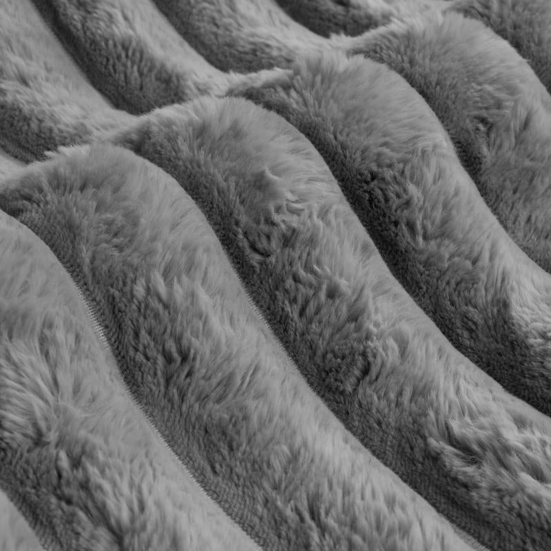 Luxurious faux fur quilt cover set with matching pillowcases.