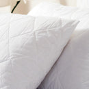 Close-up of soft quilted pillow protector texture.