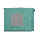 Teal quilt cover set creating a fresh, modern look in a coastal-inspired bedroom.