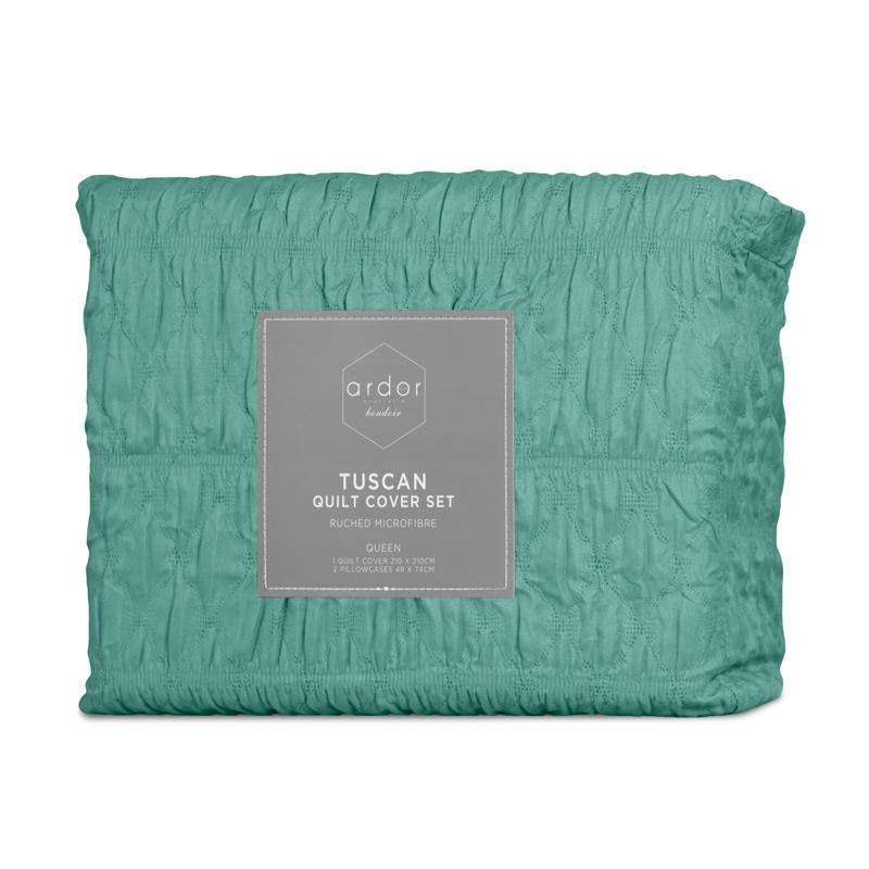 Teal quilt cover set creating a fresh, modern look in a coastal-inspired bedroom.